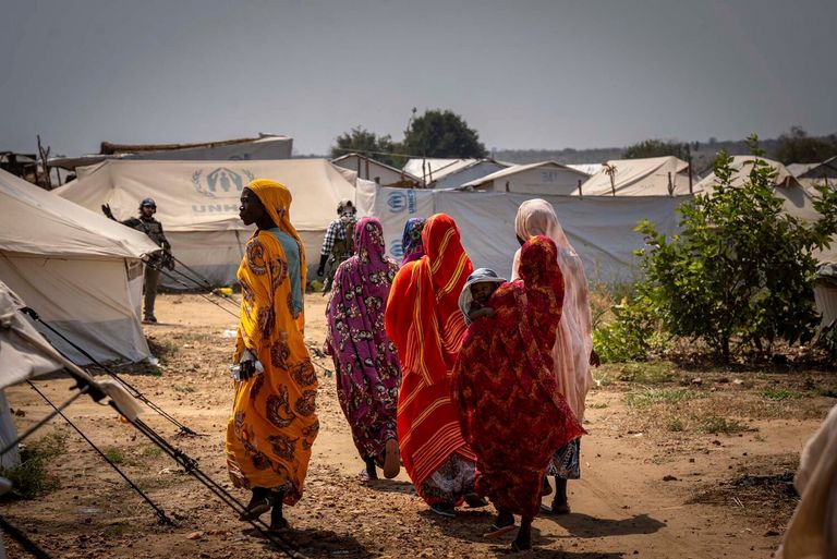 Refugee women walking in the Gorom refugee settlement