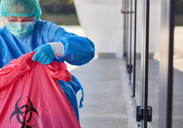 EHS worker with waste bag