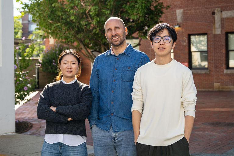 Boston University neuroscientist Robert Reinhart (center) standing with Wen Wen (left), a postdoctoral research associate, and Chenyang (Leo) Lin.