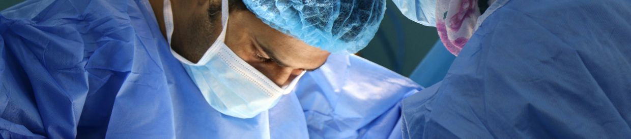 Close-up of surgeons performing surgery