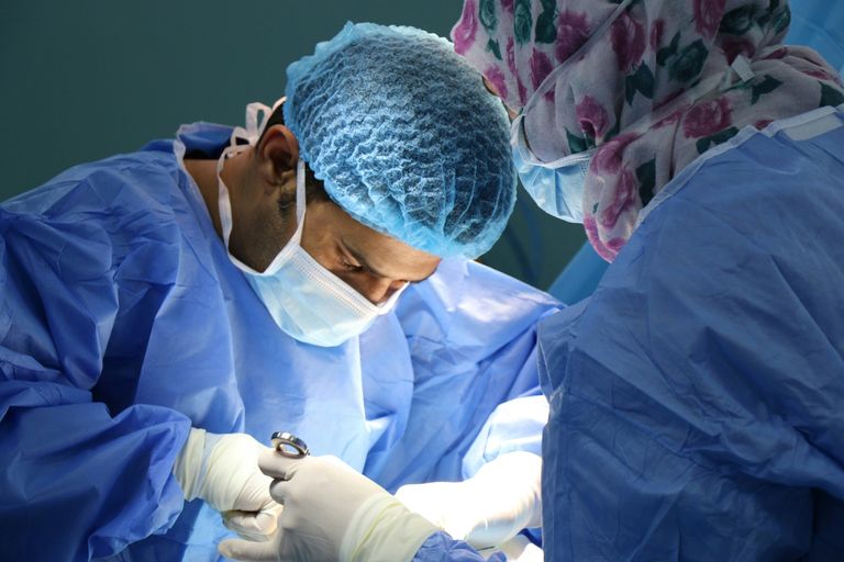 Close-up of surgeons performing surgery