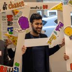 Students in Innovate@BU program holding up colorful frame signs