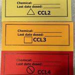 Examples of yellow, orange and red chemical containment labels