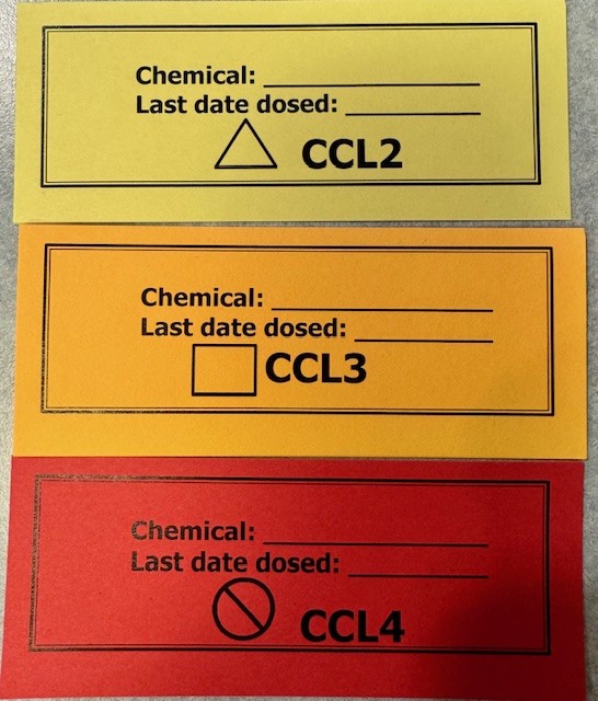 Examples of yellow, orange and red chemical containment labels