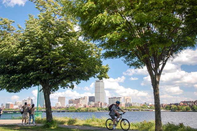 People on walking, running and biking paths along Boston's Charles River