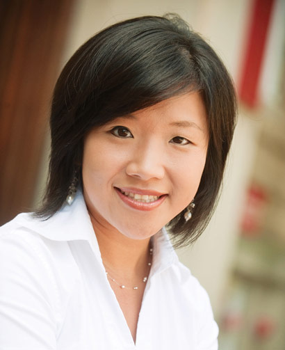 Mina Tsay wearing a white blouse and smiling 