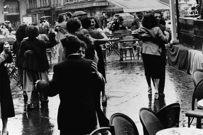 Old black and white photograph of people dancing in Paris after World War I