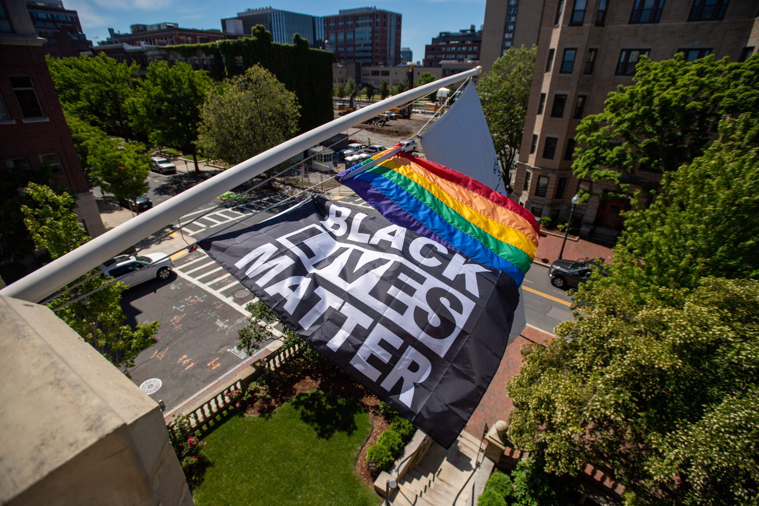 A Black Lives Matter flag flies above the Dahod Family Alumni Center
