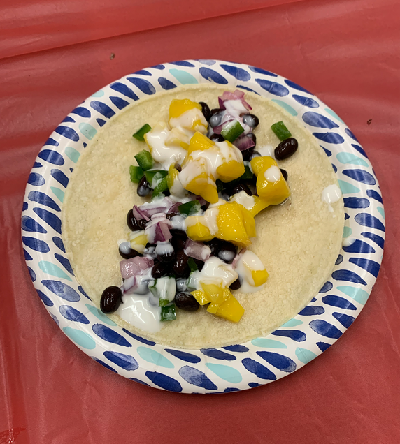 To display an assembled taco.