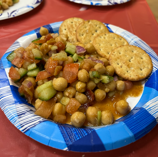 Chickpea chaat once served on a plate with crackers.