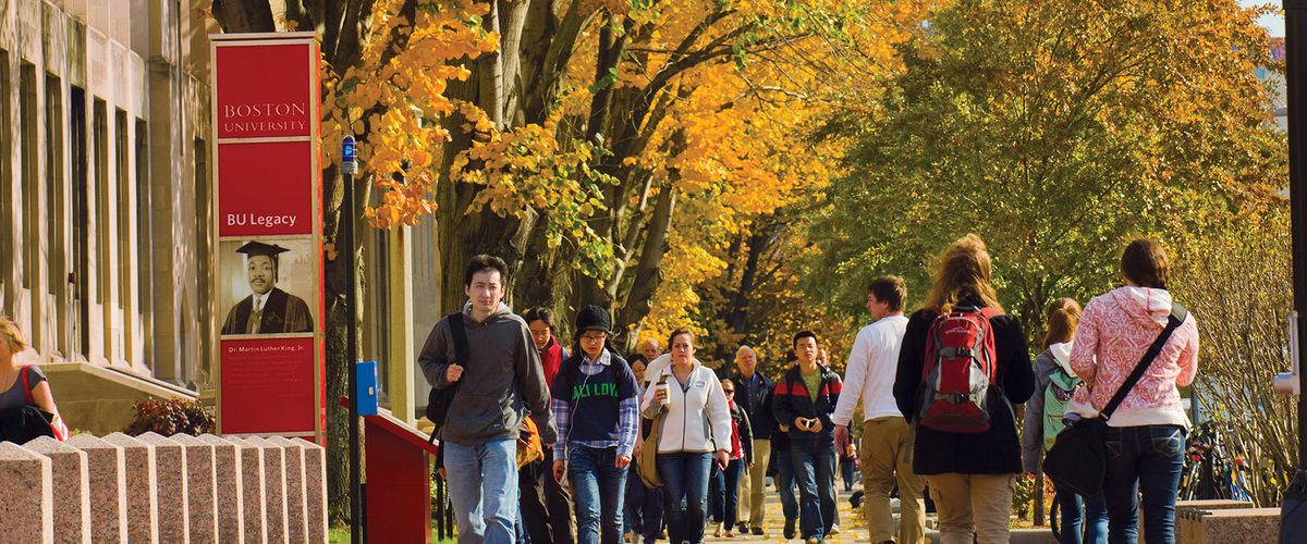 Students walk down Commonwealth Avenue in Fall