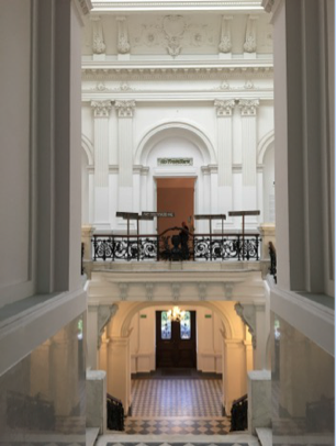 View of second floor stairway at Zachęta with Daniel Baker’s “Copse” (2006) visible in hallway. Photo courtesy of the author.