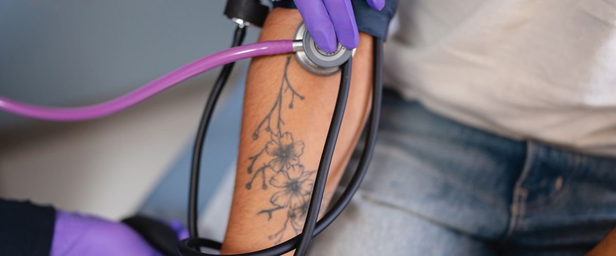 Student getting blood pressure reading