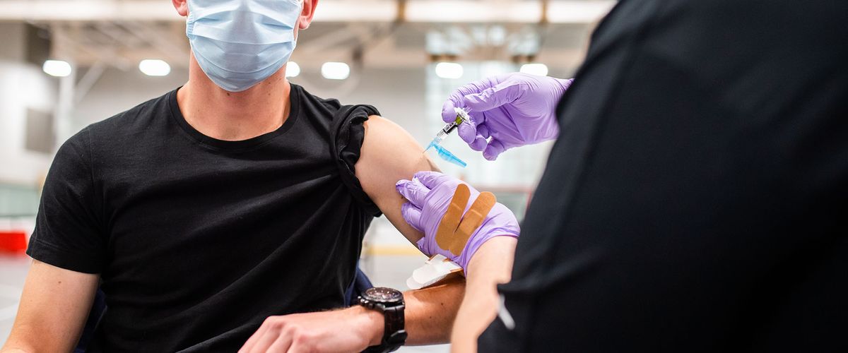 Student getting vaccine from health provider