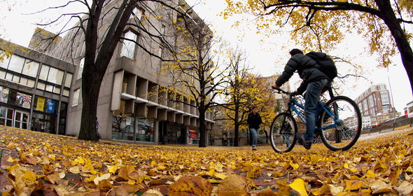 fall view of person on bike outside the student union