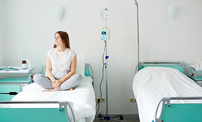 thumbnail-woman-sitting-on-hospital-bed