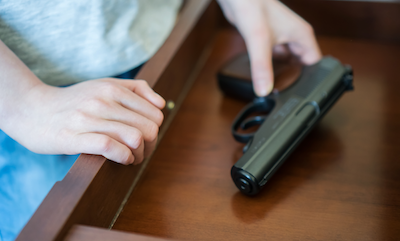 Child finding pistol in drawer.