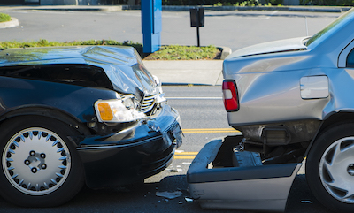 Auto accident involving two cars on a city street