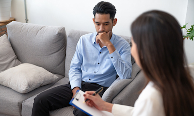 A man talking with a counselor