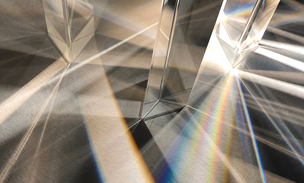 Light refracting through prisms