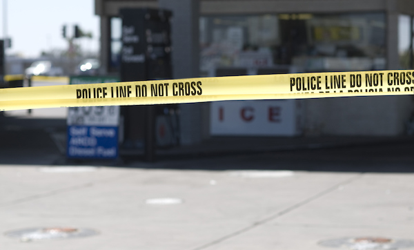 Yellow crime scene tape surronds gas station