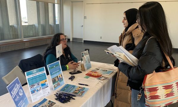 Students speak to staff at local organizations