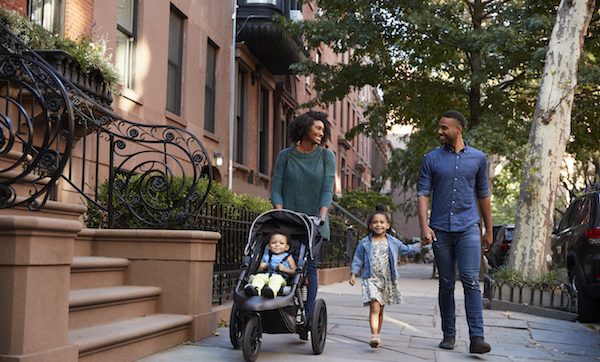 Family taking a walk down the street