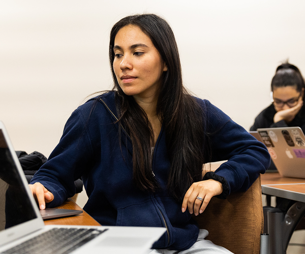 Student works on a laptop in class