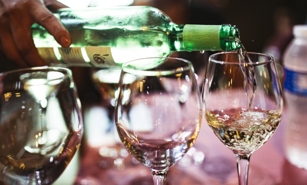 White wine being poured into a glass