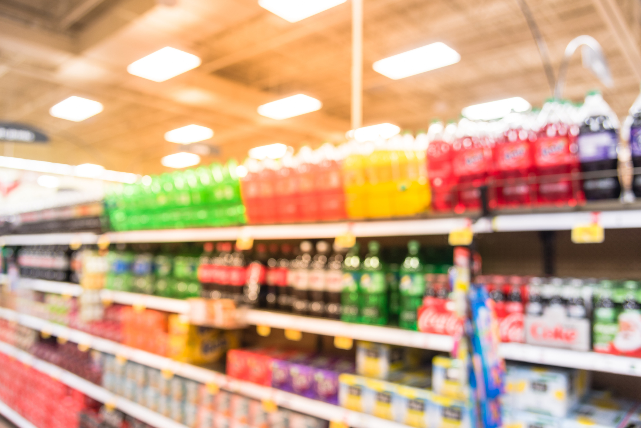 Abstract blurred soft drinks aisle in American store
