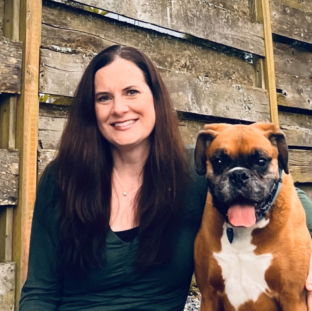 Headshot of Lisa Galvin and her boxer Max