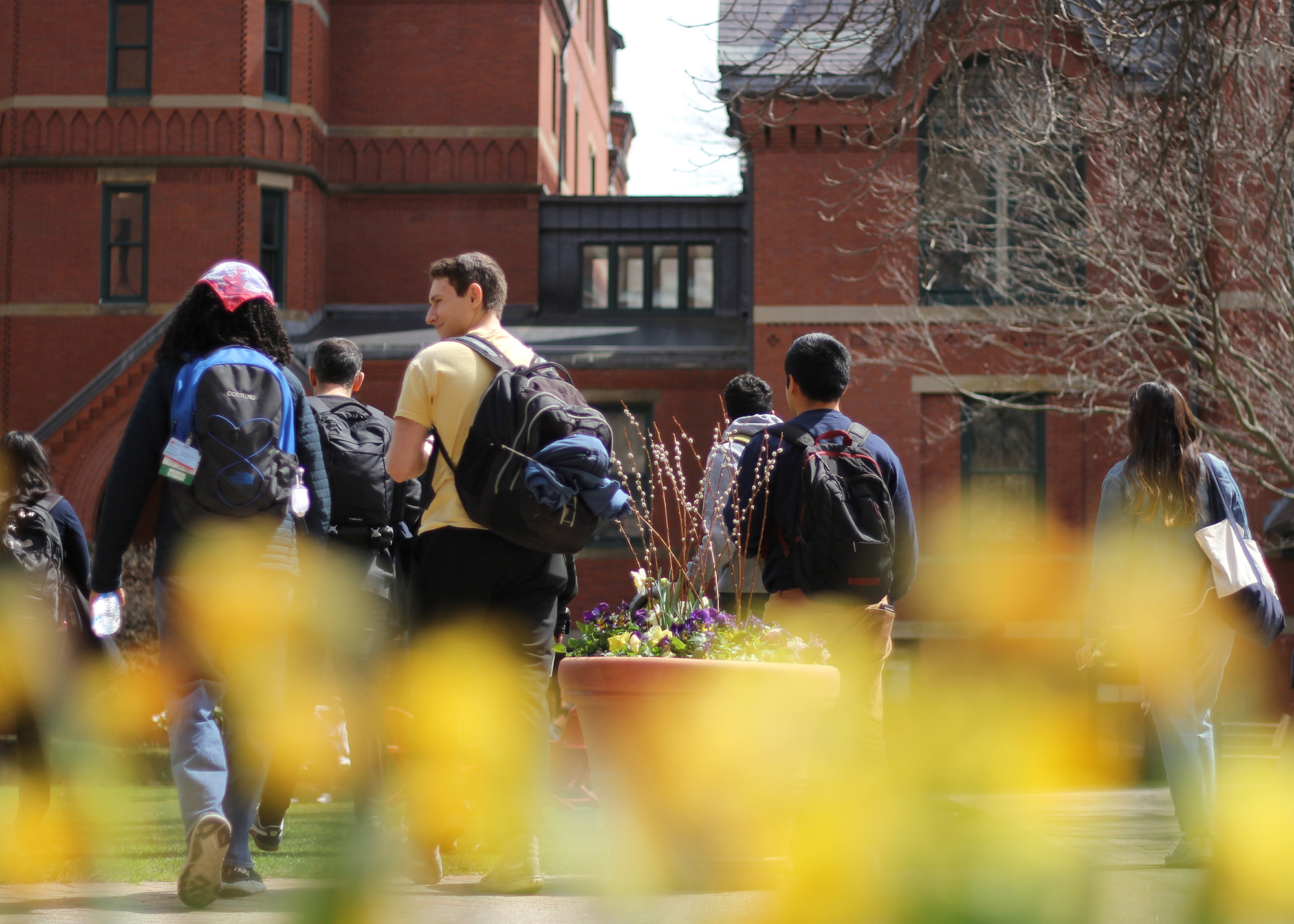 Students walk in front of the Talbot building on a sunny day