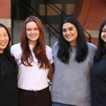 Gwen Ip, Summer Kaeppel, Audeaneh Saberi, and Kavya Ganugapati in front of the Talbot Building.