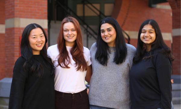 Gwen Ip, Summer Kaeppel, Audeaneh Saberi, and Kavya Ganugapati in front of the Talbot Building.