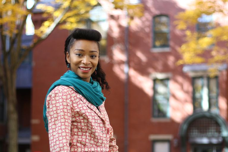 Headshot of Krista Idowu in front of the Talbot Building