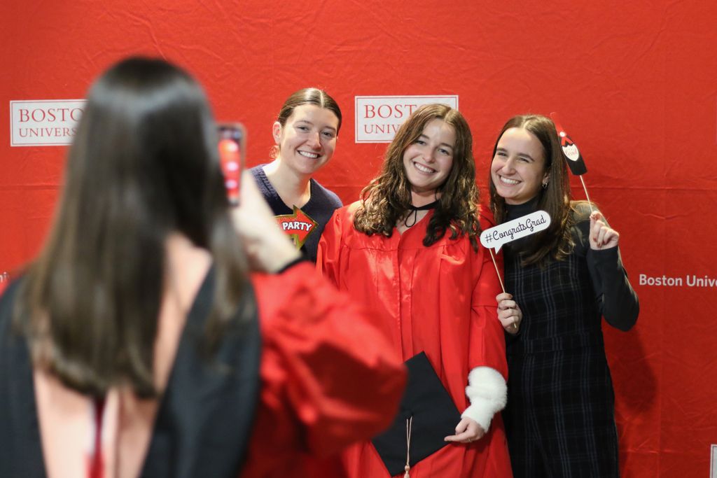 Graduates take photos at the 2024 December Graduate Reception