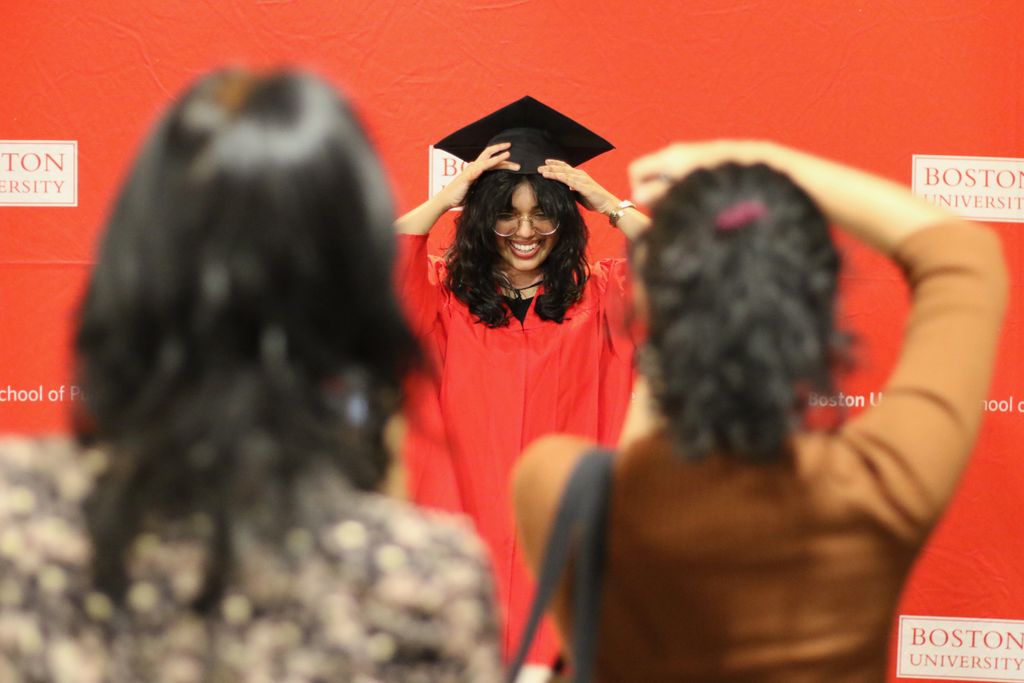A graduate has her photo taken at the 2024 December Graduate Reception