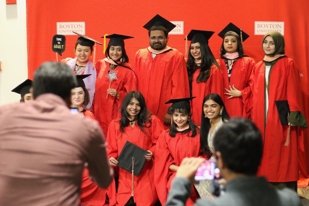 A group of students poses together at the 2024 December Graduate Reception