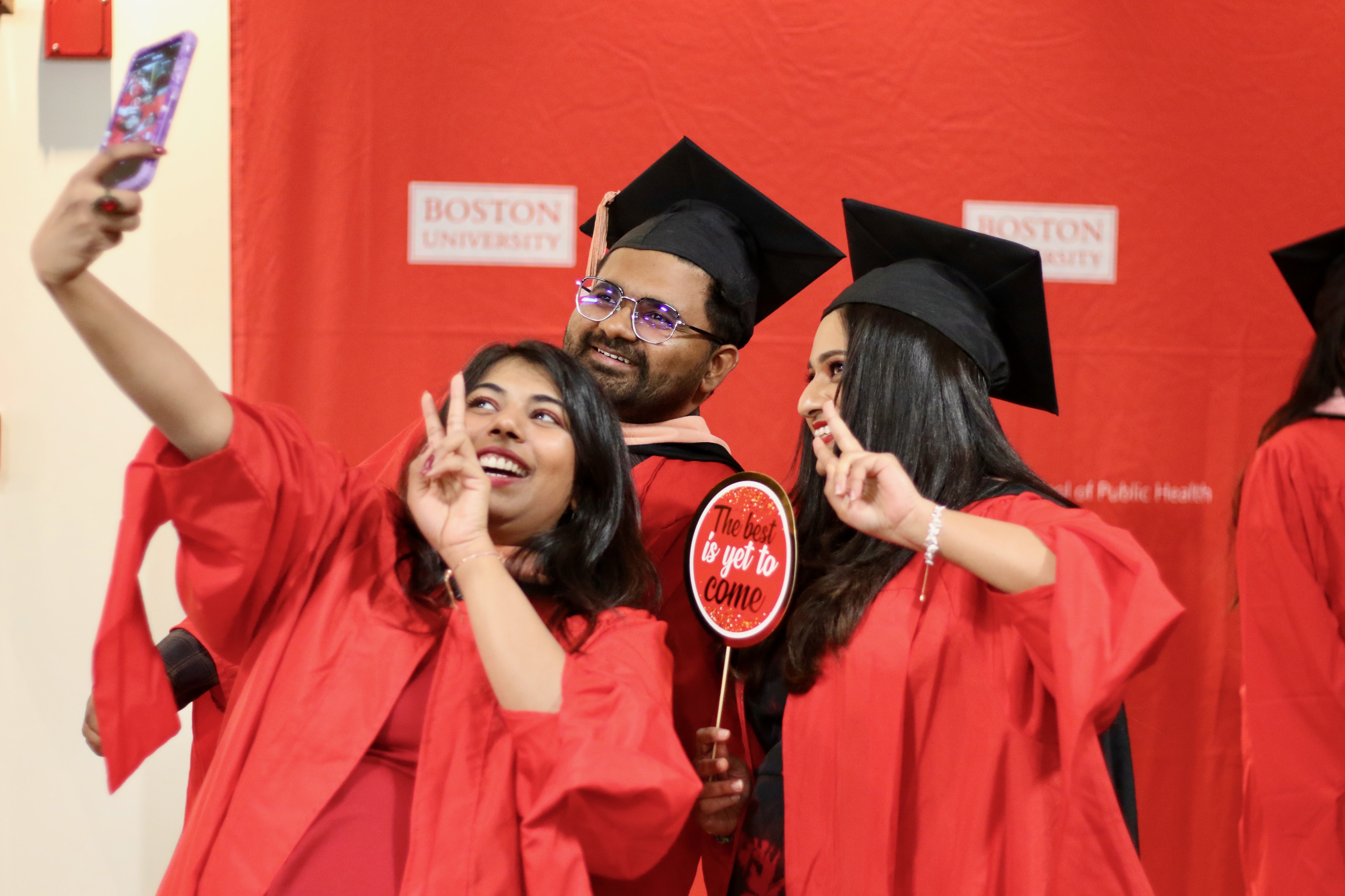 Graduates pose for a selfie at the 2024 December Graduate Reception