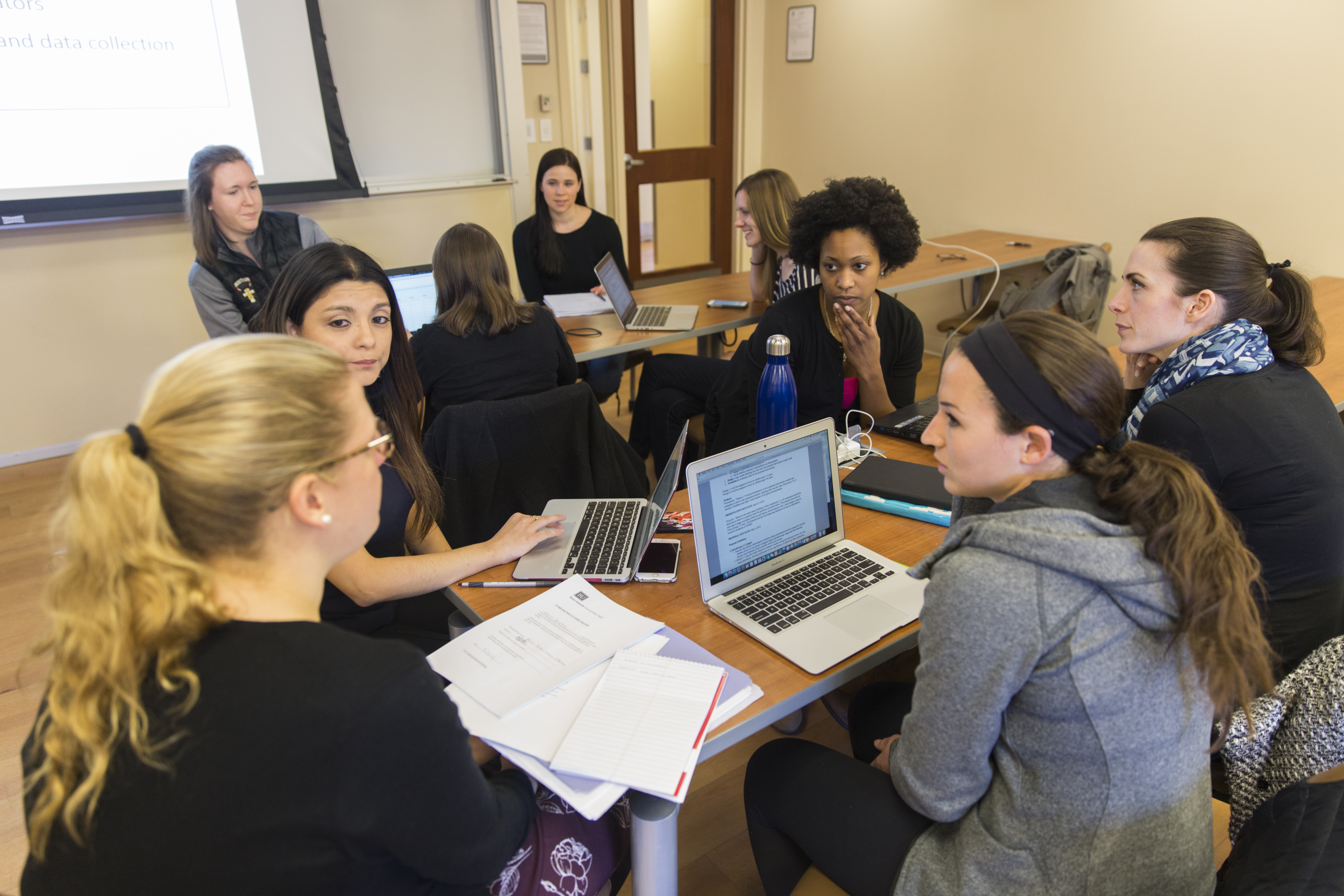 BUSPH students sit and work together as a group
