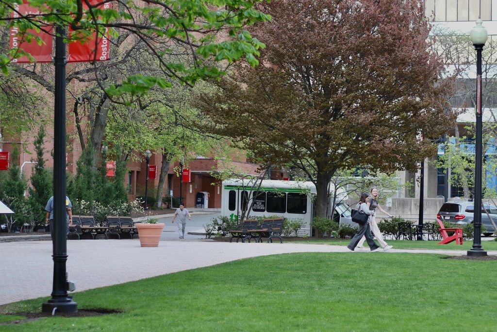 Students crossing the BU Medical Campus green.