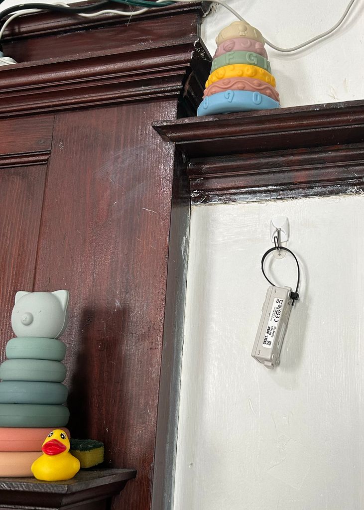 An indoor temperature sensor installed at a childcare center.