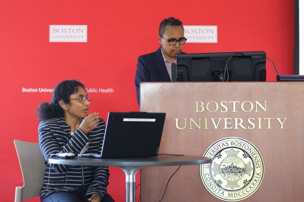 Awardee Revathi Ananthakrishnan (seated left) begins her presentation following an introduction from Scarlett Bellamy, chair and professor of biostatistics (standing right).
