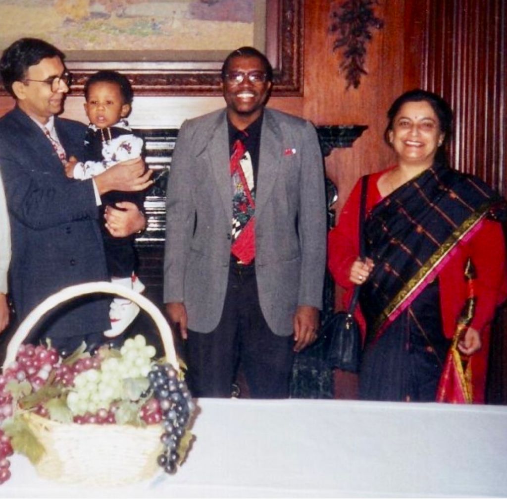 Ghulam Nabi Kazi holds M.A. Jama’s son, alongside a faculty member, Joe, and Madhu Sood from India.