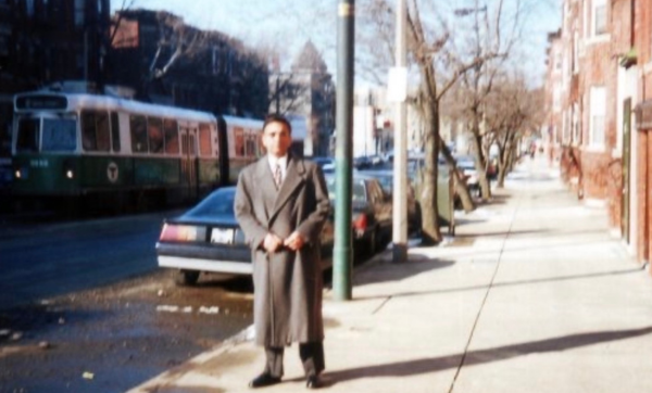 Ghulam Nabi Kazi outside his South Huntington Avenue apartment as a Green Line streetcar goes by in 1997.