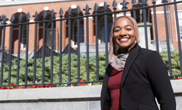 Ramla Hagi stands in front of the Massachusetts Statehouse