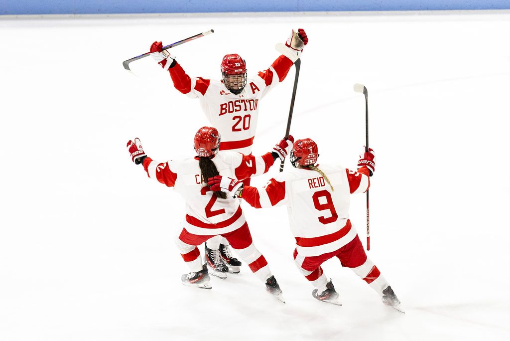 Women’s ice hockey team players Maeve Carey (COM'26) (left), Julia Shaunessy (CAS'24, SPH'26), and Lola Reid (CAS’28) celebrate Shaunessy’s goal during a game against Boston College, November 15. The Terriers will face off against Harvard in the first round of the Beanpot on Tuesday. Photo by Fia McCarty/BU Athletics