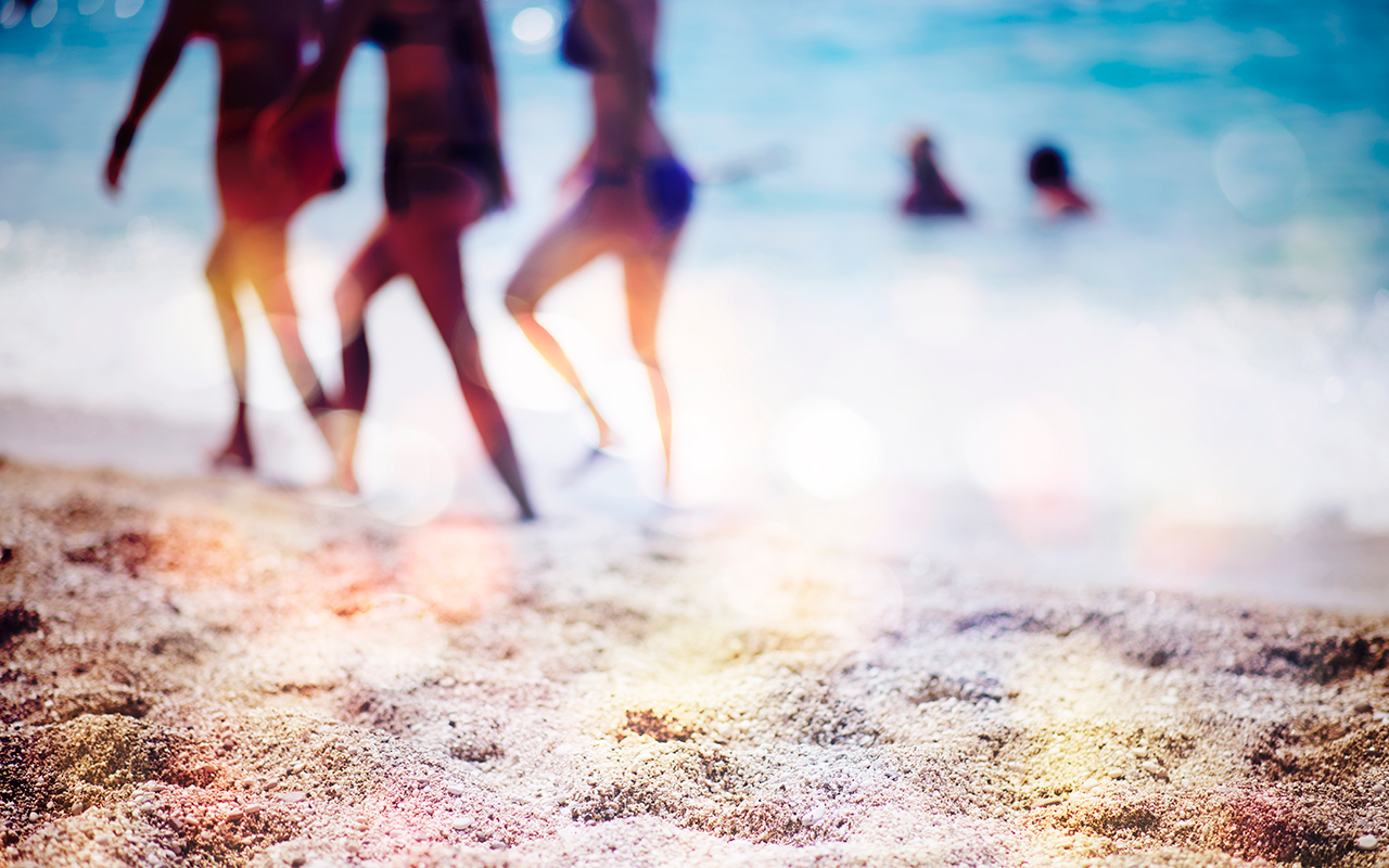 People walk on the beach