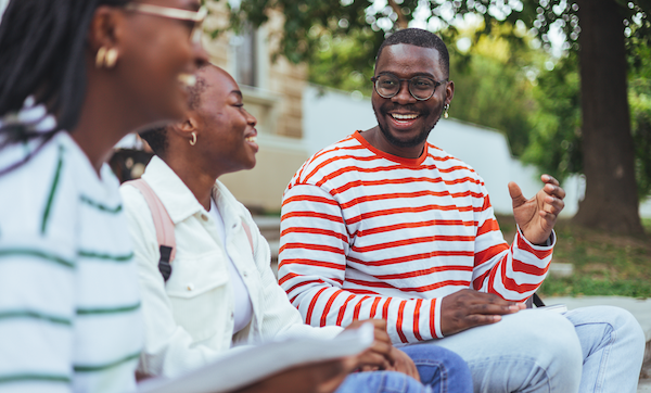 Black college students laughing and talking
