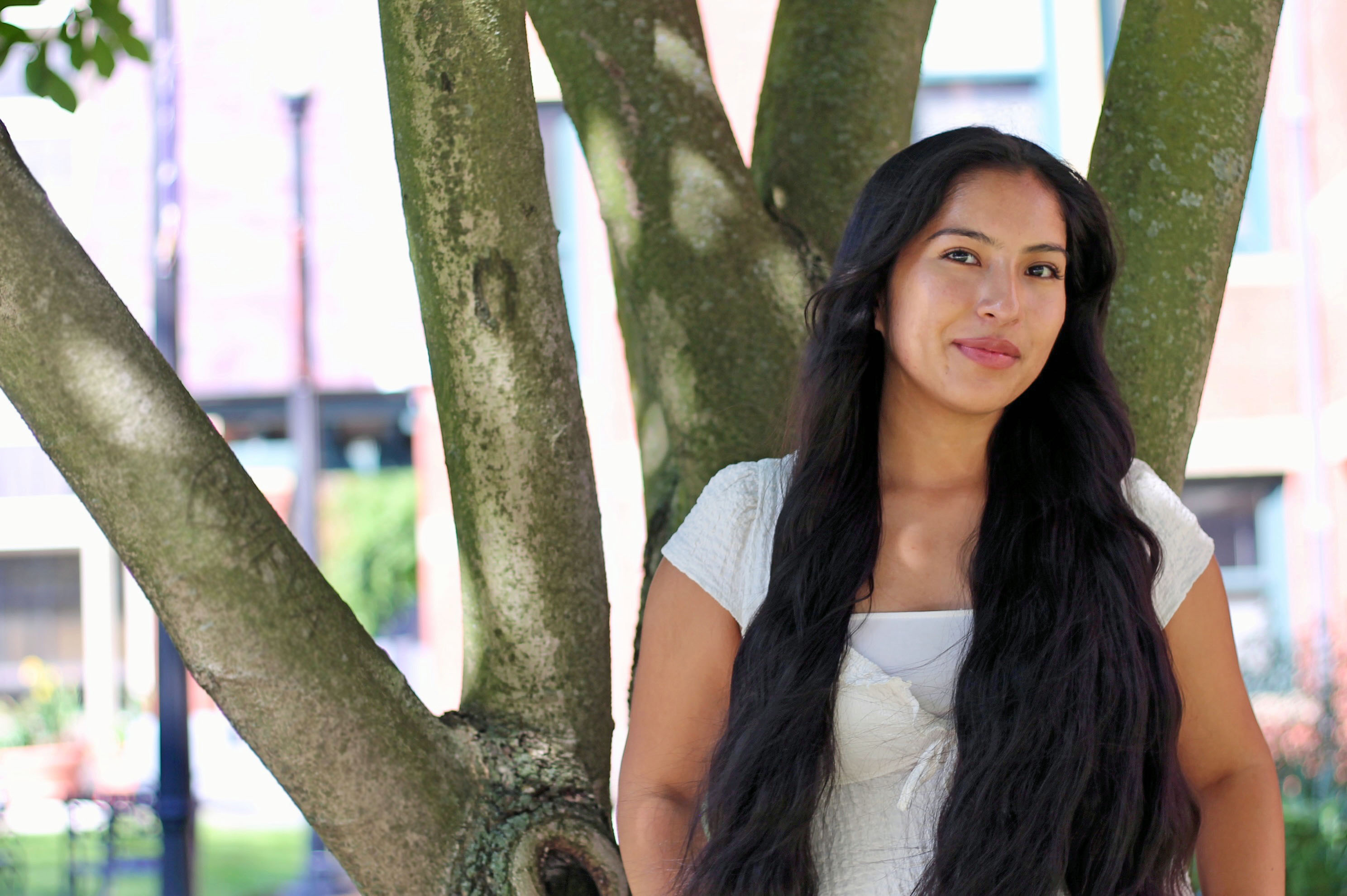 Jamila Rodriguez poses in front of a tree on Talbot Green. Photo: Megan Jones